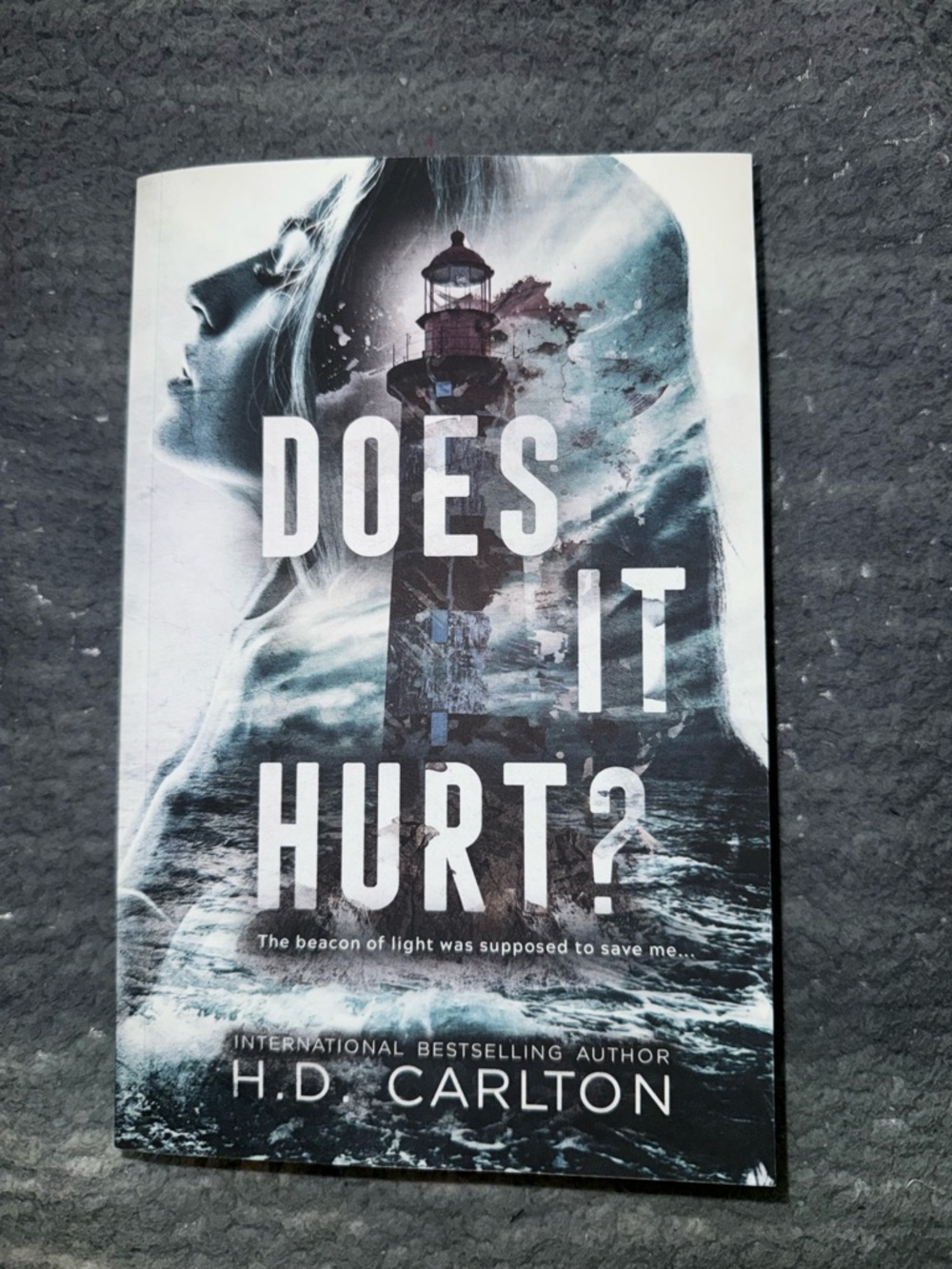 Does It Hurt? by H.D. Carlton - Moody Blue Lighthouse Paperback